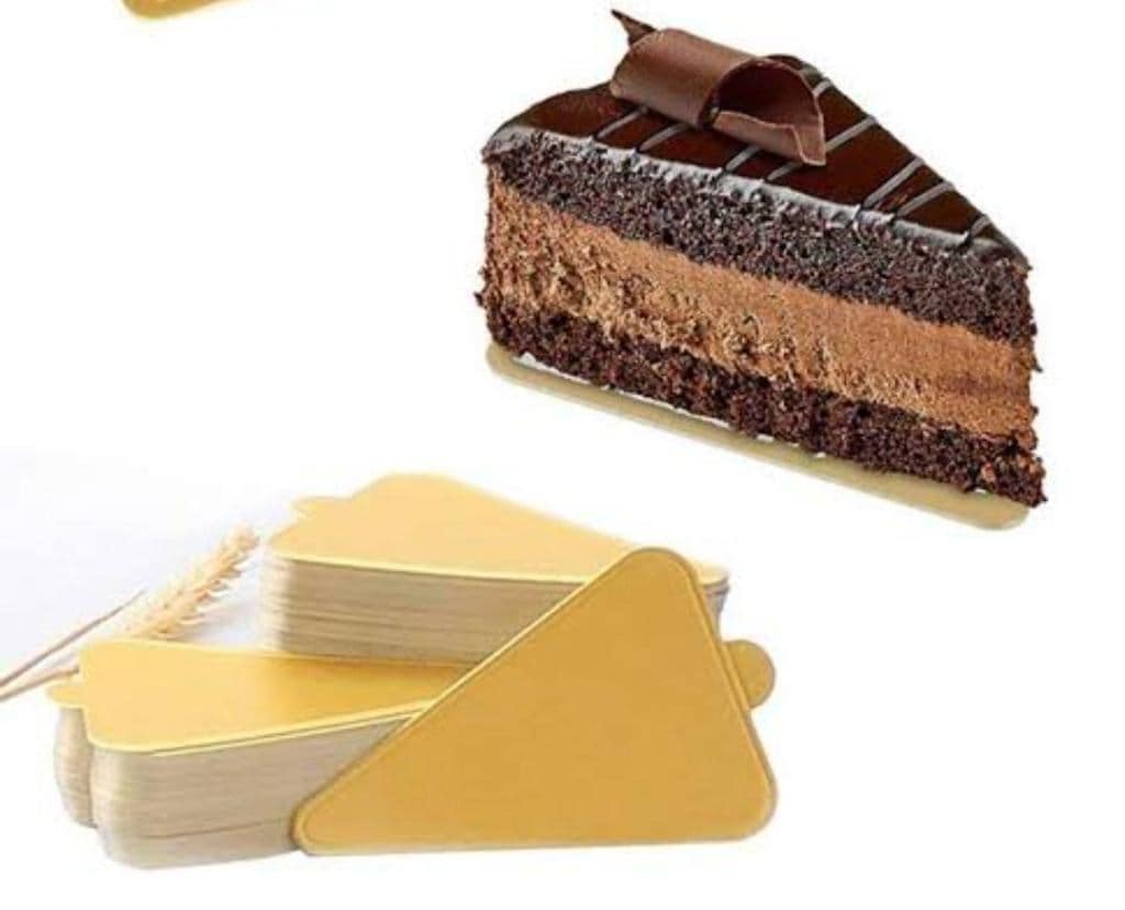 A triangle shaped cake topped with chocolate stock photo - OFFSET